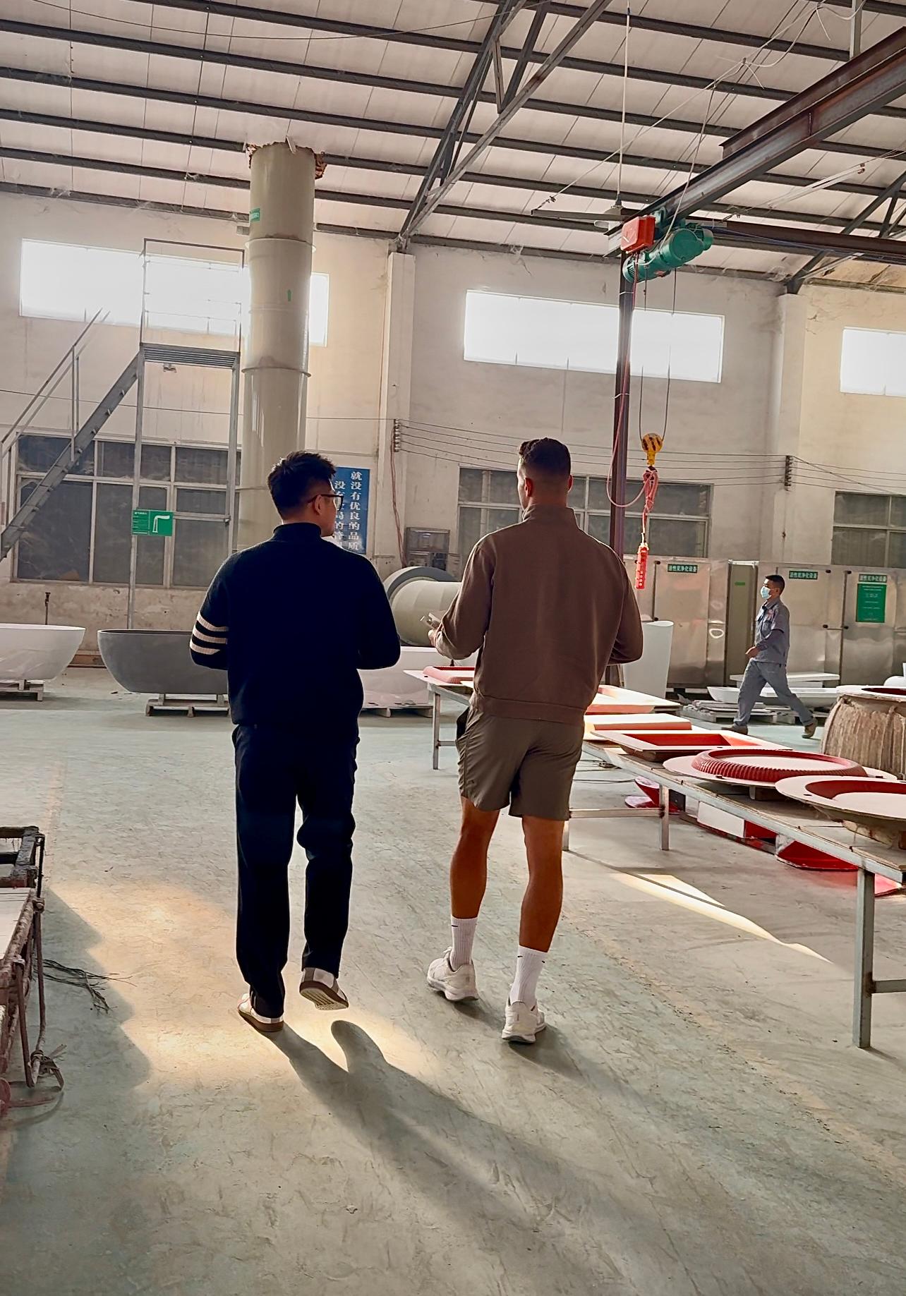 Showing client around Miluo Guangdong factory (2).jpg